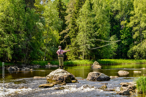 River area in spring. Scenic view of a salmon river landscape in Farnebofjarden national park in north of Sweden.