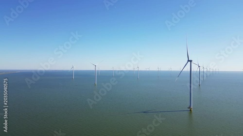 Alternative energy sources, wind turbines produce energy in the north sea, wind farm power plant view from height, green energy.
