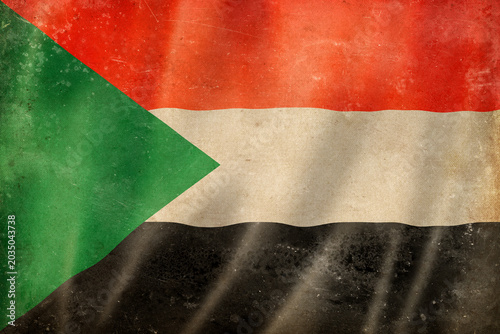 Old vintage flag of Sudan, worn and stained