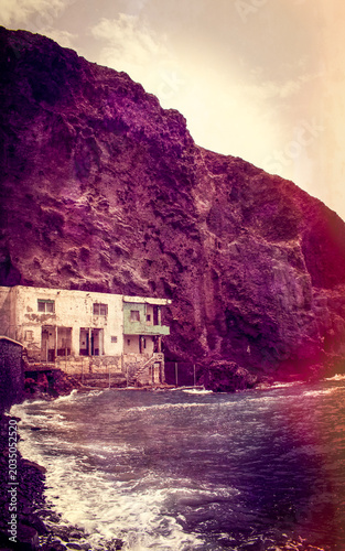 Tenerife, Canary Islands, Spain: a dilapidated house on the pebble and black-sand beach of Playa de Los Roques in Los Roques de Fasnia coastal village 