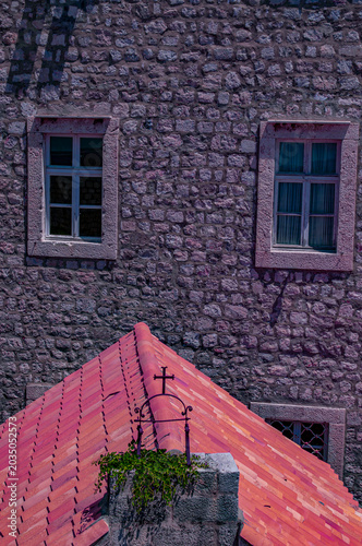 Dubrovnik, Croatia, Europe: windows of a stone building and detail of the roof of The Church of St. Margaret (Crkva sv. Margarita), historic, single-nave Renaissance building in the Old Town 
