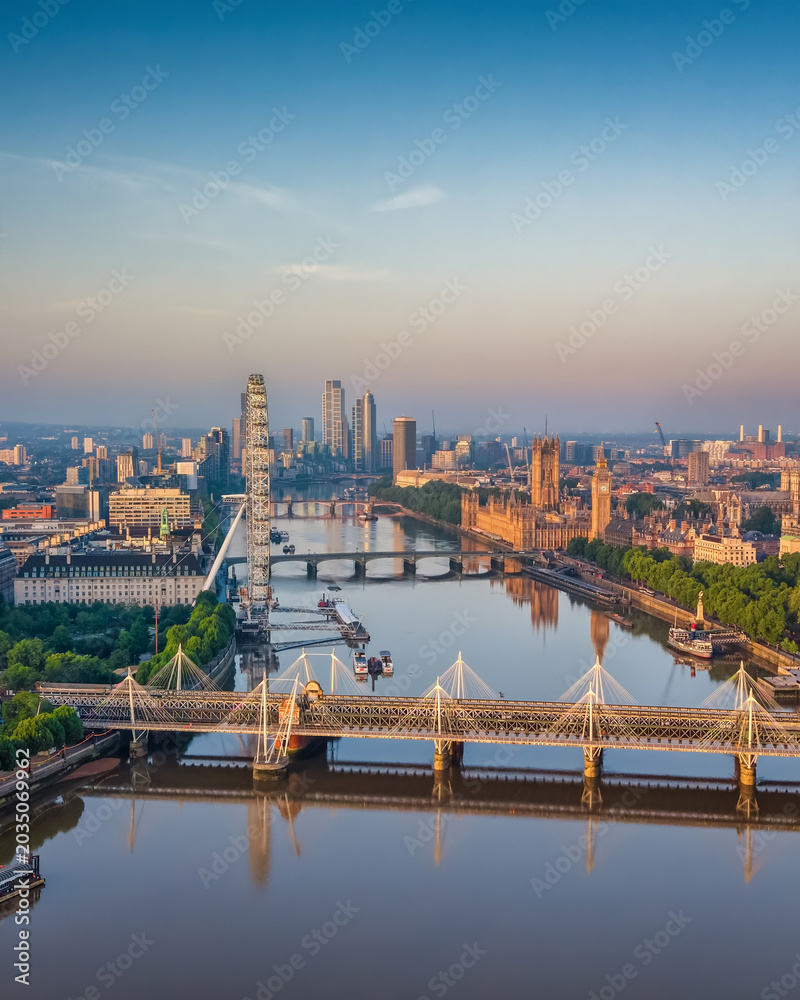 Naklejka premium Panoramic aerial view of the skyline of London, England, with Southbank and Embankment, Westminster Palace back to Nine Elms during summer sunrise
