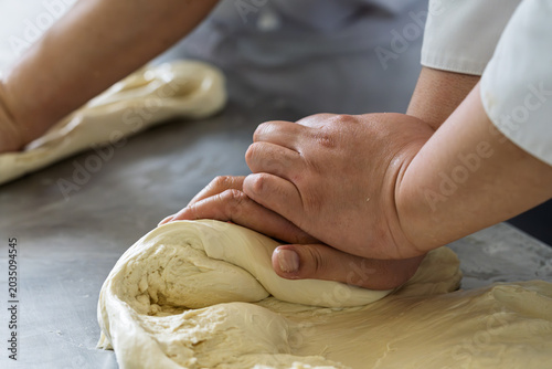Baker Hand Kneading White Dough For Making Noodles