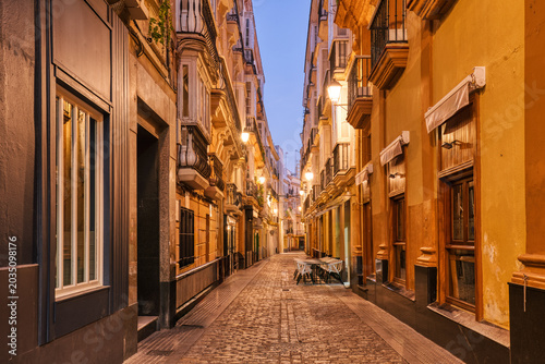 Charming narrow alley in Cadiz, Andalusia at Twilight