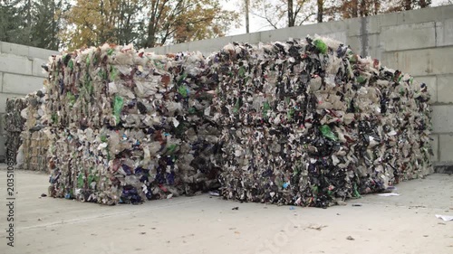 Pressed plastic bottles. Environment. Industry. Landfill of pressed plastic bottles and their recycling. Ecology. Recycling of secondary raw materials.