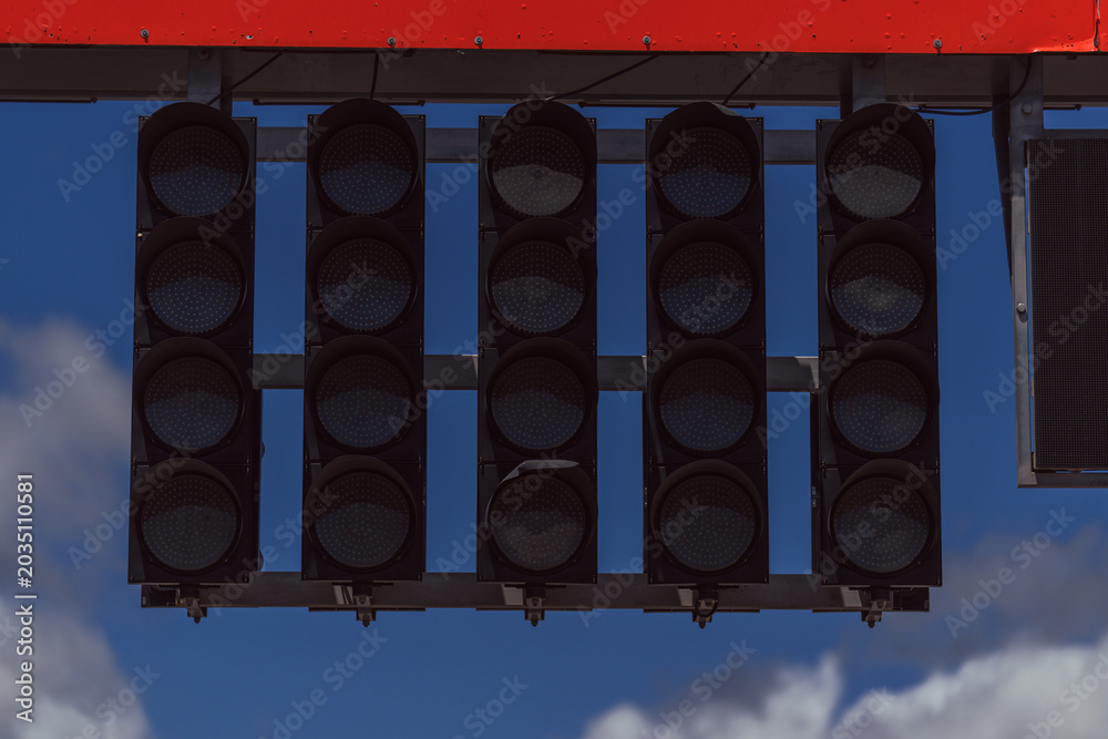 Obraz premium Motorsport starting lights on a speed circuit. Car racing. Competition. Graphic resource
