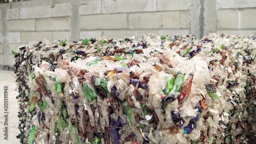 Pressed plastic bottles. Environment. Industry. Landfill of pressed plastic bottles and their recycling. Ecology. Recycling of secondary raw materials.