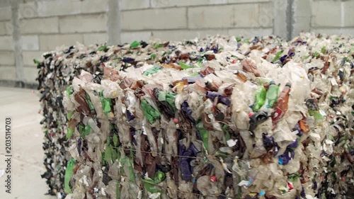 Pressed plastic bottles. Environment. Industry. Landfill of pressed plastic bottles and their recycling. Ecology. Recycling of secondary raw materials.