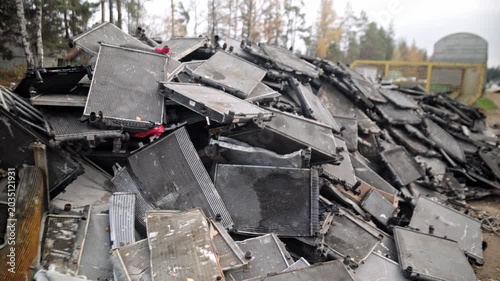
Recycling of old cars. Automotive scrap. Recycling. Ecology and the environment. Scrap metal from old, destroyed cars. Metal recycling.