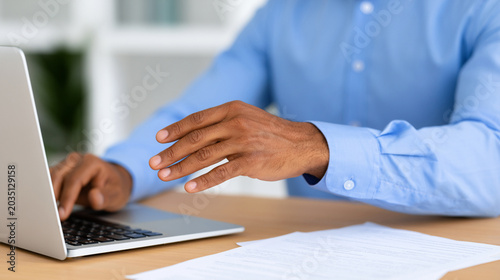 Close-up of Office Employee Stretching Stiff Fingers from Typing