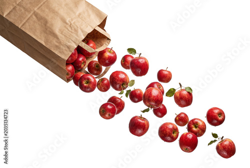 Fotografie Fresh red apples spilling from a brown paper grocery bag