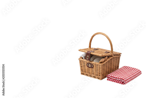 Konstfotografi Wicker picnic basket with plates and a checkered blanket
