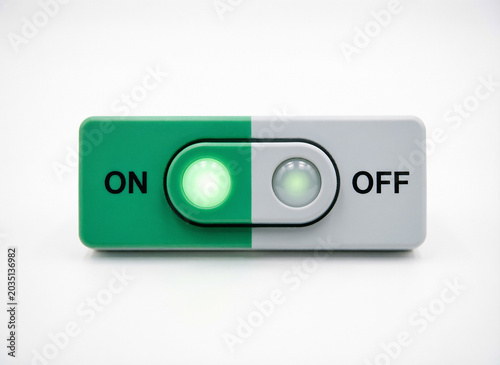 The power control panel has a round green button that indicates the power is on. The button indicator is on a white background