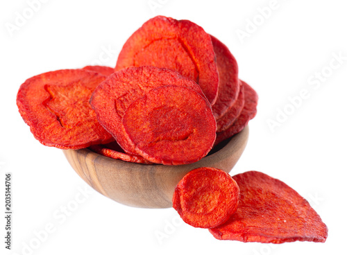 Crispy roasted carrot chips with sea salt, isolated on white background. Healthy and crunchy natural vegetable snack. Clipping path.