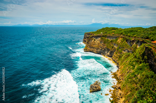 Beautiful Uluwatu coast with rocks and ocean waves, Bali, Indonesia