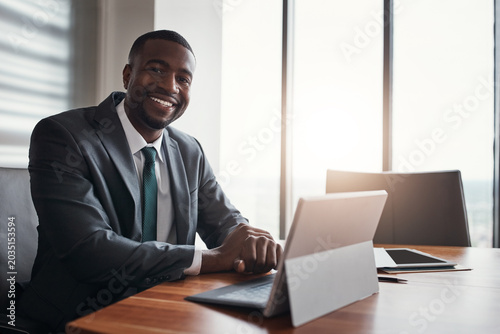 Laptop  portrait and business black man in office for research  stock trading and finance report. Corporate  financial advisor and person with pride for investor career  planning and budget review