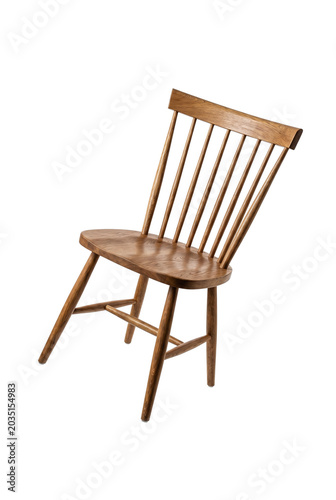 Bild auf Leinwand Wooden windsor dining chair tilted on back legs