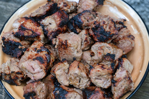 Quadro su tela freshly grilled pork shashlik meat chunks with a deliciously charred crust, pile