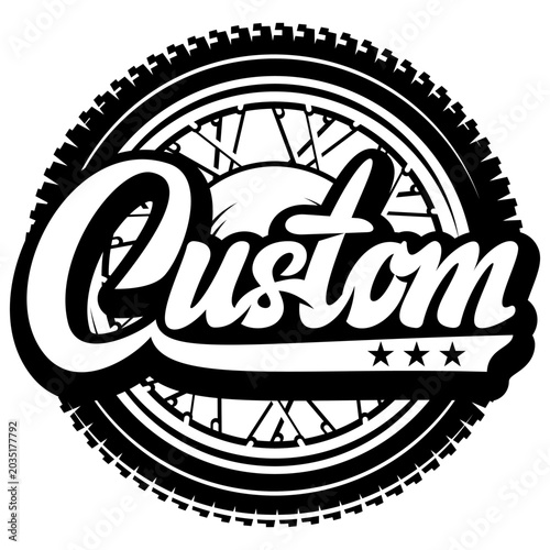 Custom motorcycle wheel with spokes and tire tread, featuring the word Custom in a stylized script font with three stars.