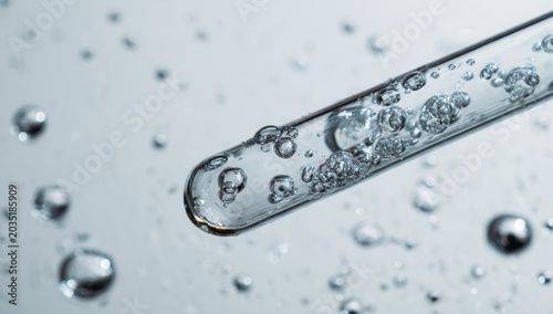 Close-up of Bubbles in a Test Tube with Water Droplets.