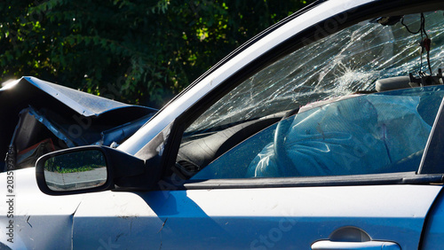 Fotografie Silver passenger car after a traffic collision on a city street