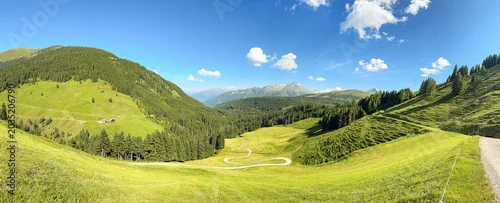 Panel kuchenny z motywem Panoramic View Of Green Mountains And Meadows Under Blue Sky In Königsleiten Austria Tirol During Summer Season For Travel And Tourism
