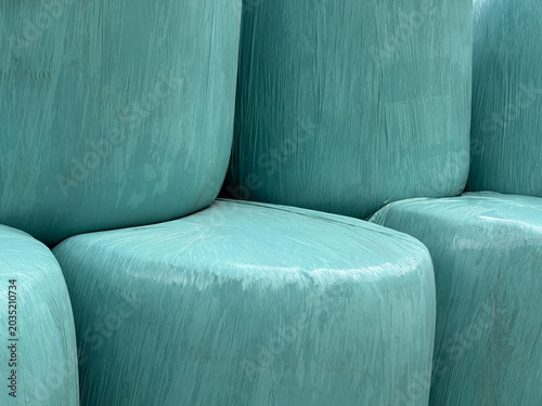 Close-Up Of Turquoise Hay Bales Wrapped In Plastic In Tirol Austria During Summer For Agricultural Or Environmental Projects And Designs