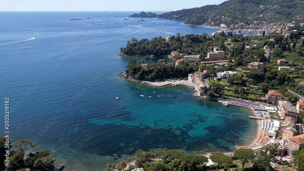 Obraz premium Italy , Liguria , Rapallo , drone aerial view of San Michele di Pagana Beach close to Santa Margherita and Portofino near Genoa . The amazing mediterranean costline in Tigullio gulf natural park 