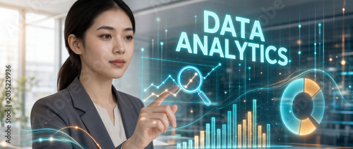 Data analytics concept with person and a glowing holographic dashboard with charts and magnifier and lettering in a bright office