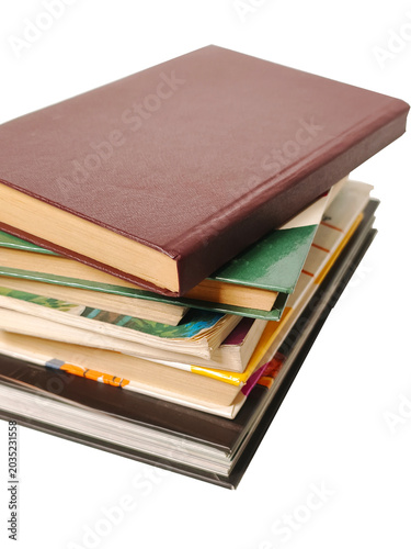A stack of various, multicolored books, isolated on white, PNG.