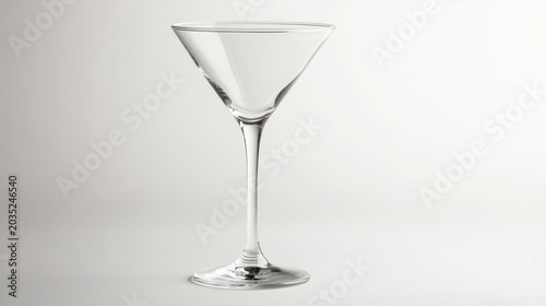 Empty martini glass on white background side view