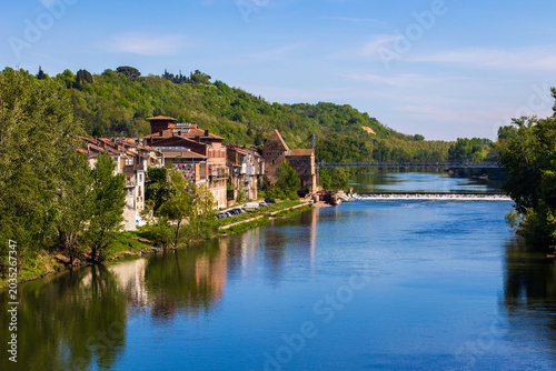 Historic center of Villemur-sur-Tarn on the riverbank seen from the Pont Eugène Boudy bridge