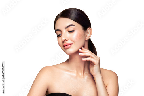 Portrait beautiful young woman with clean fresh skin. Model with healthy skin looks at an empty space, close up portrait. Cosmetology, beauty and spa
