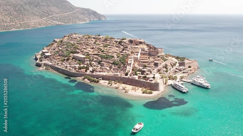 Aerial panoramic view of Spinalonga fortress island and turquoise sea