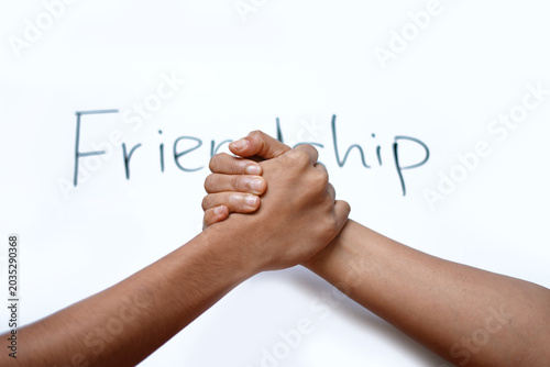 Friends friendship hand shake on white background. photo