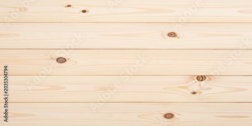 Light pine wood texture with natural knots and grain pattern.
