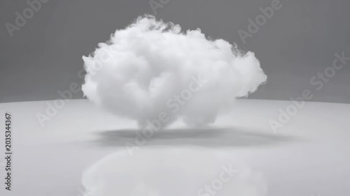 Single fluffy white cloud hovering in place on a clean minimal studio background with light shadow underneath. Concept of data storage and clear thinking