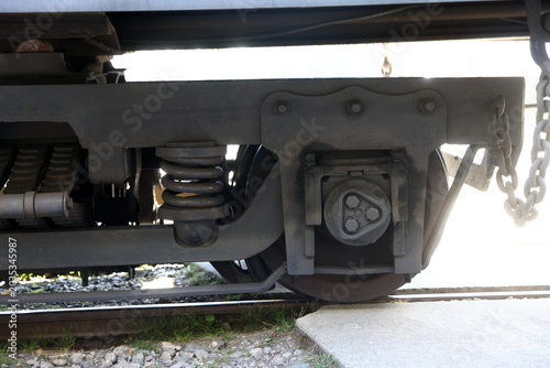 Canvastavla mechanical side profile of a train car bogie assembly, steel wheels, and suspens