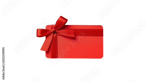 Konstfotografi Isolated vibrant red gift card adorned with beautiful satin ribbon and bow for presents