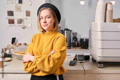 Portrait of young professional at work place in coffee shop