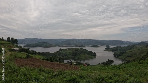 Scenic sunrise morning at Lake Bunyonyi with peaceful reflections and rolling green hills, relaxing Uganda travel footage