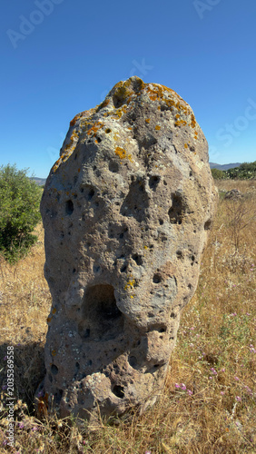 Ancient menhir standing in Tratalias archaeological landscape Sardinia