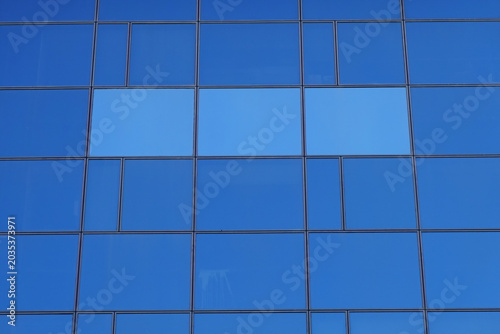glass windows rectangular shapes pattern on modern office building facade