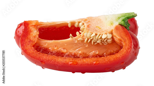 Cut red bell pepper with seeds and water drops isolated on transparent background.