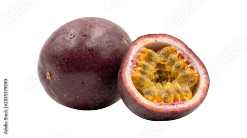 Whole passion fruit and half cut open revealing seeds isolated on transparent background.