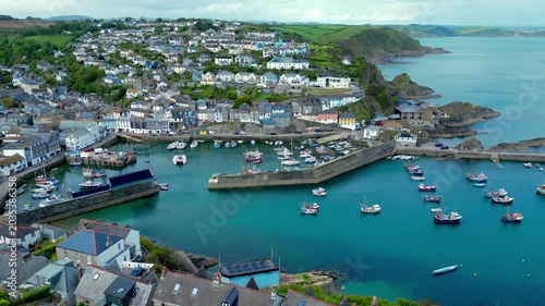Aerial views of the harbor in the costal village and port of Mevagissey on the south coast of Cornwall in the southwest of England.