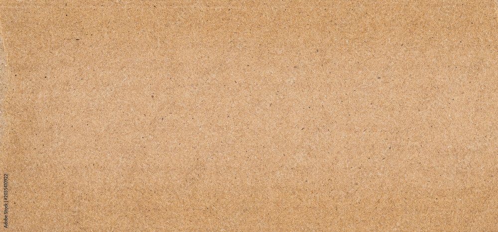 Fototapeta premium Recycled cardboard texture background with natural fibers and rustic surface. Eco friendly backdrop for sustainable designs.