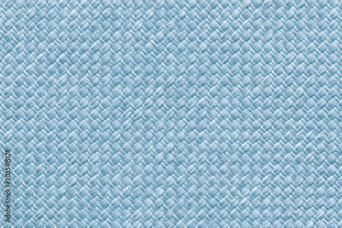 Light blue woven textile texture background, macro. Structure of pastel sky fabric material backdrop with weave pattern