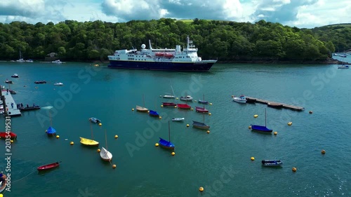 Aerial views of the seafront and estuary in the costal town of Fowey on the south coast of Cornwall in the southwest of England.