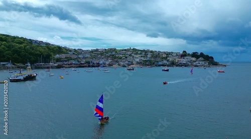 Aerial views of the seafront of the costal town of Polruan viewed from Fowey on the south coast of Cornwall in the southwest of England.